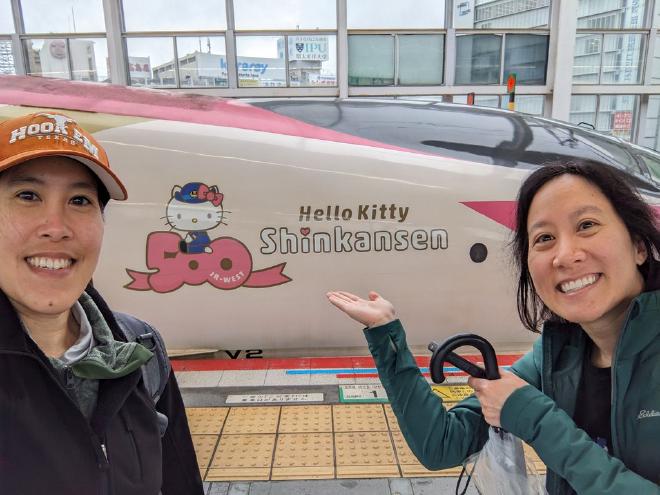 Van and I stand beside the Hello Kitty shinkansen