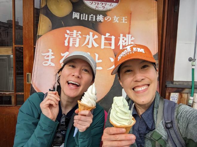 Van and I hold up our swirled soft-serve ice cream.