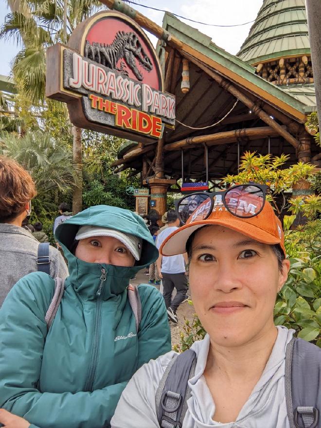 Standing next to the sign for Jurassic Park - The Ride