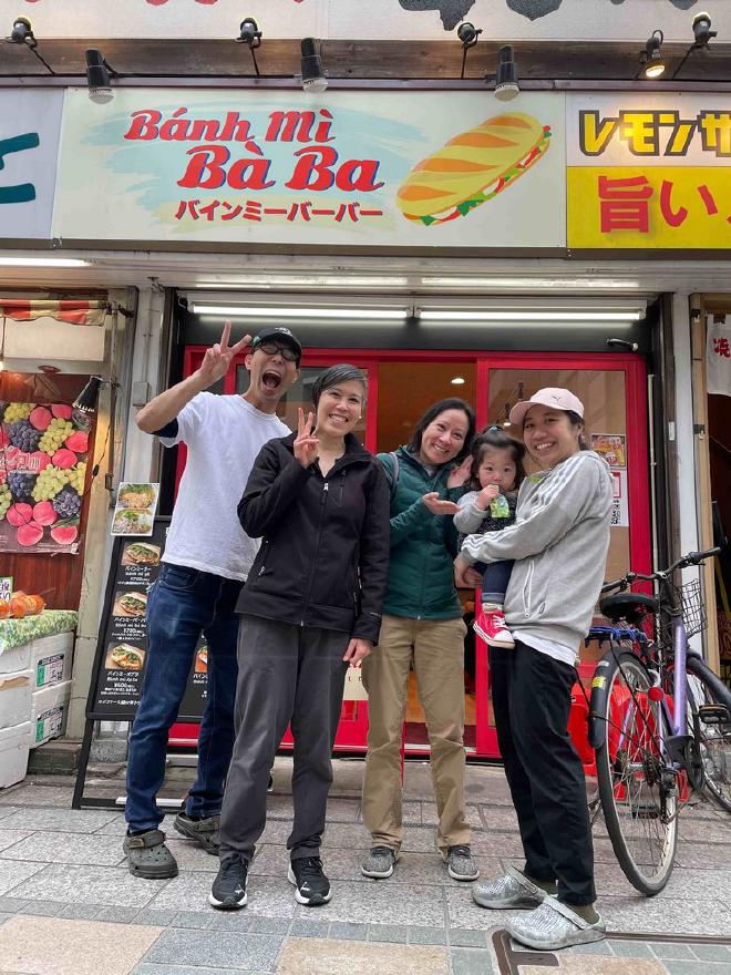 Posing for a picture with the family who owned Banh Mi Ba Ba.