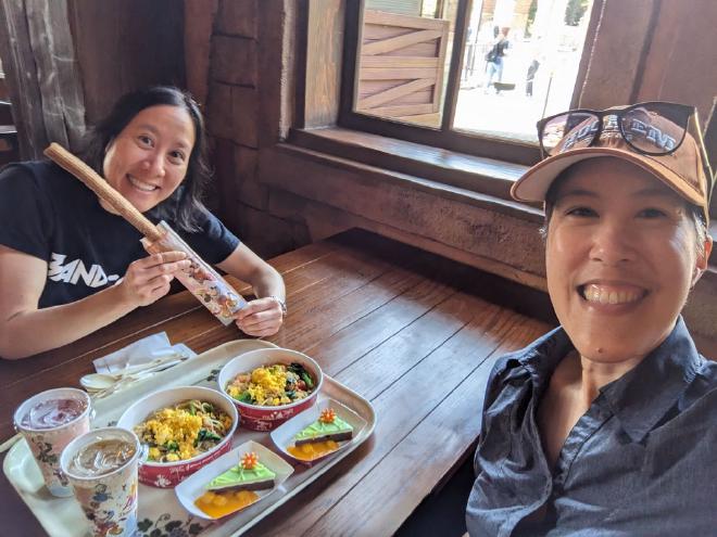 Van and I sit at a table at the Zambini Brothers restaurant with our tray of food.