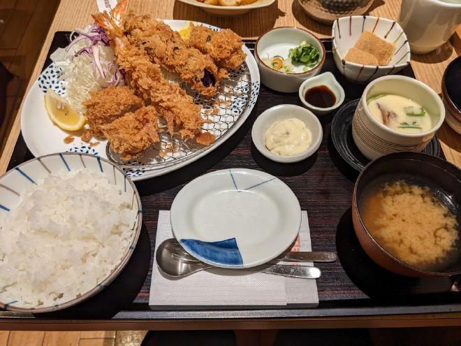 My tray of food included a bowl of rice, miso soup, chawan-mushi, shredded cabbage, breaded and fried shrimp, eggplant, meatballs and port cutlet, and mochi.